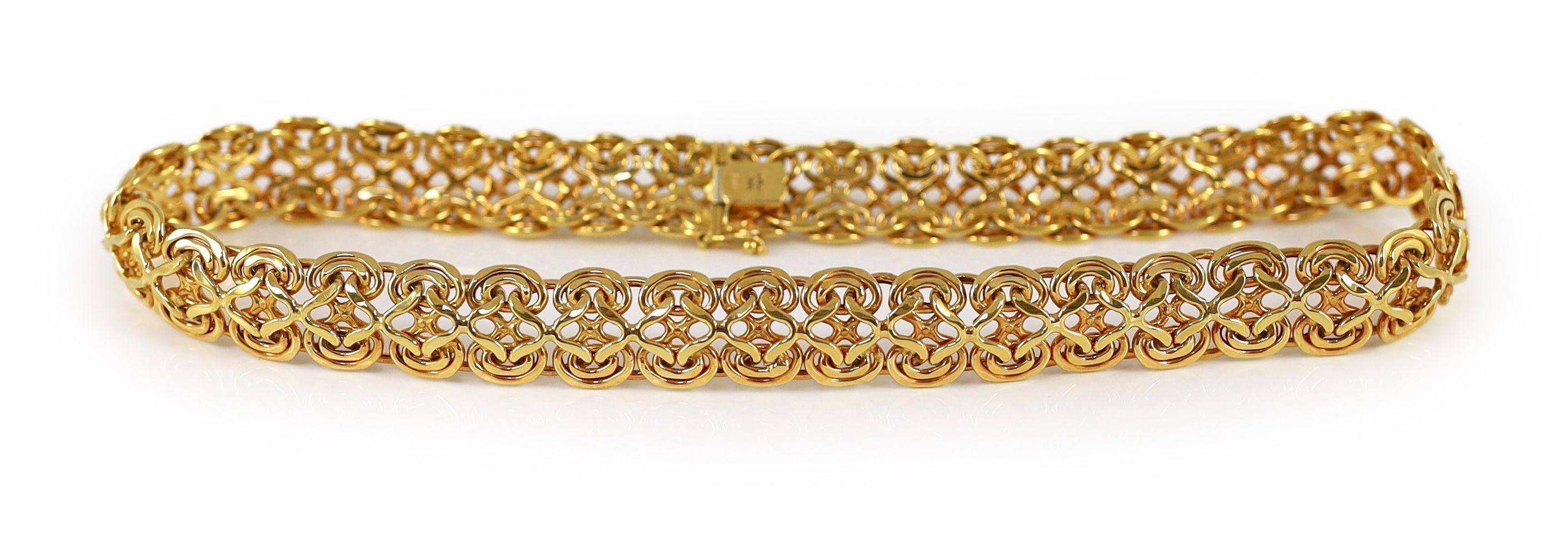A modern 14k gold pierced scroll link necklace